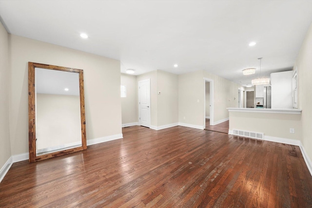 457 E 91st St, Chicago, IL 60619 - unfurnished living room with dark wood-style flooring, recessed lighting, and baseboards