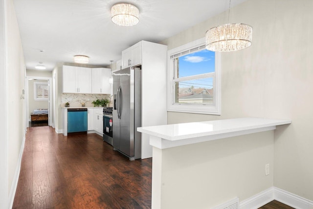 457 E 91st St, Chicago, IL 60619 - kitchen featuring stainless steel refrigerator with ice dispenser, dishwasher, a chandelier, light countertops, and a peninsula