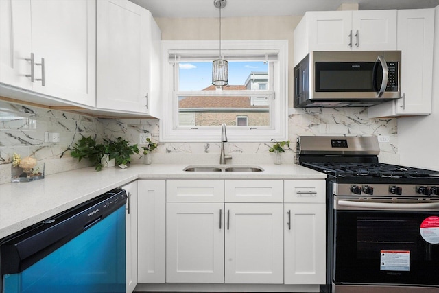 457 E 91st St, Chicago, IL 60619 - kitchen with appliances with stainless steel finishes, a sink, white cabinetry, light countertops, and backsplash