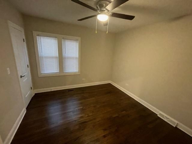 1317 Franklin Ave, Chicago Heights, IL 60411 - empty room with ceiling fan, dark wood-style flooring, visible vents, and baseboards