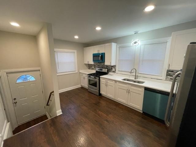 1317 Franklin Ave, Chicago Heights, IL 60411 - kitchen with appliances with stainless steel finishes, dark wood finished floors, white cabinets, and a sink