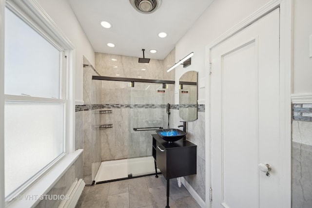 bathroom with a stall shower, recessed lighting, visible vents, and vanity