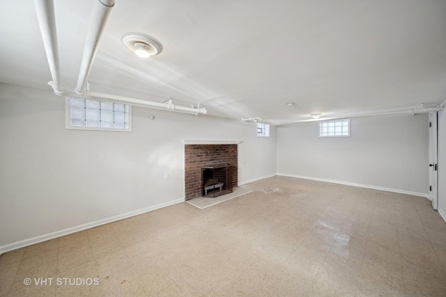 below grade area with baseboards and tile patterned floors