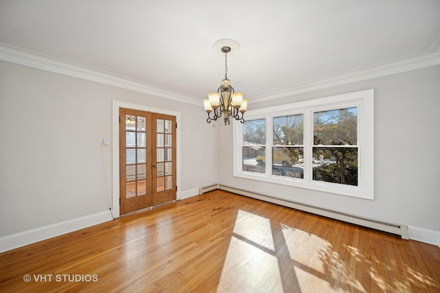 unfurnished dining area with ornamental molding, french doors, light wood-style flooring, and baseboard heating