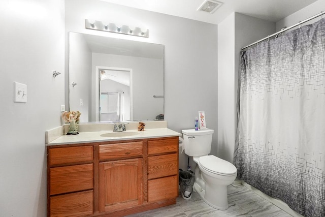 bathroom featuring visible vents, vanity, and toilet