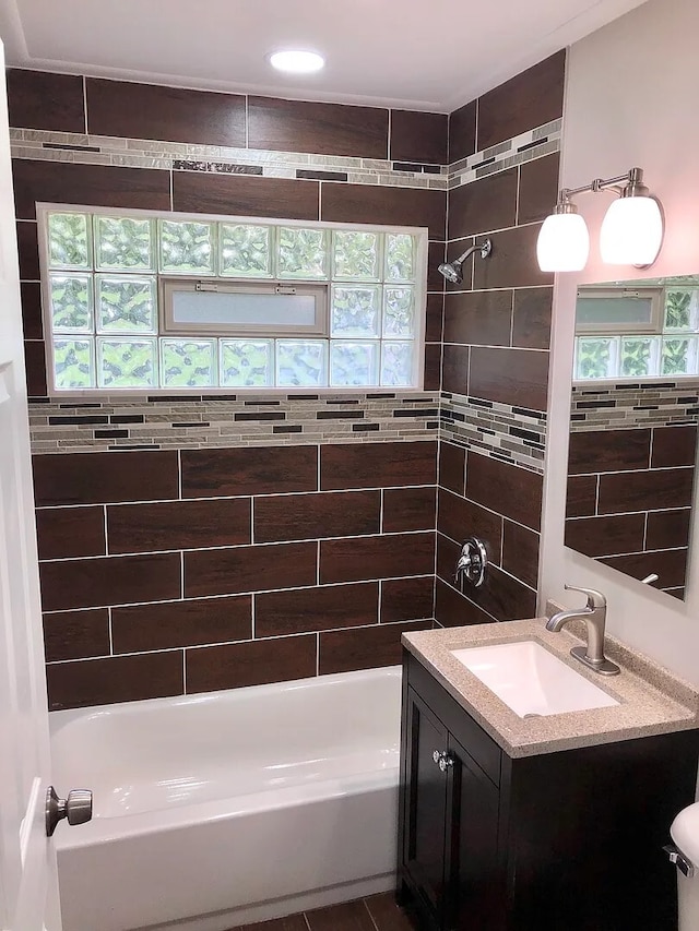 full bathroom with shower / bathtub combination and vanity