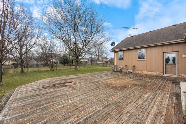 deck featuring a lawn and a fenced backyard