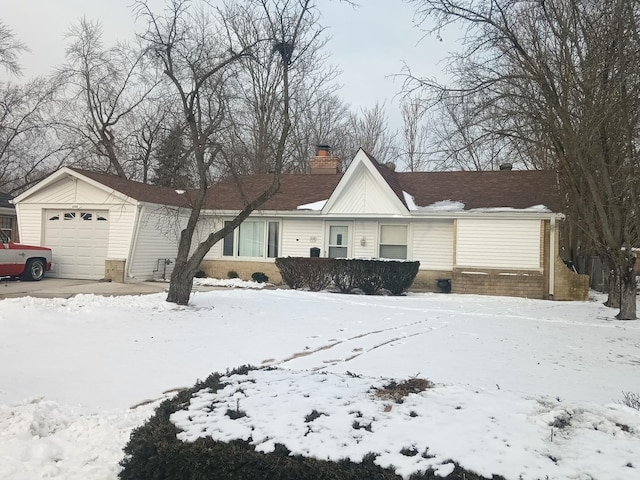 single story home featuring a garage and a chimney