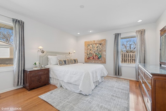 bedroom with light wood-style flooring, recessed lighting, and baseboards