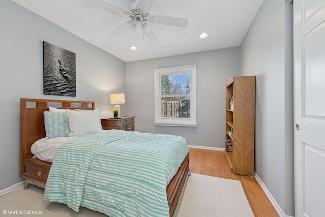 bedroom with a ceiling fan, recessed lighting, wood finished floors, and baseboards