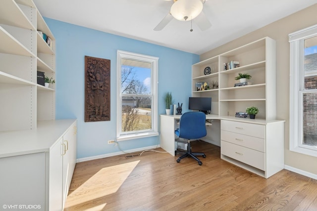 office with a wealth of natural light, baseboards, and light wood finished floors