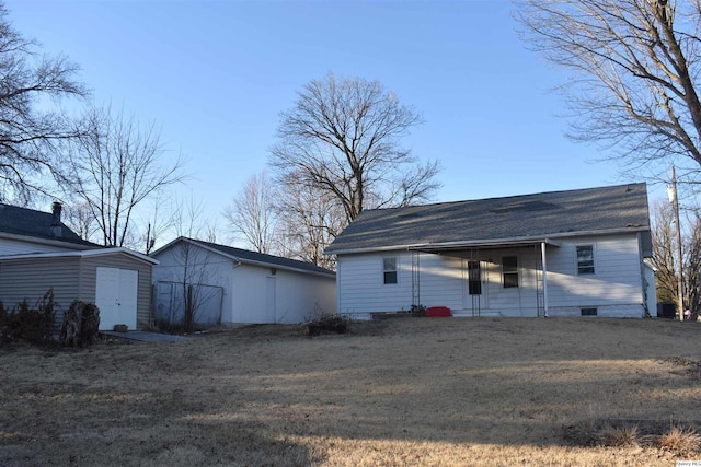 garage featuring a storage shed