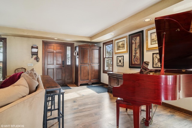 entryway with recessed lighting, light wood-style flooring, and baseboards