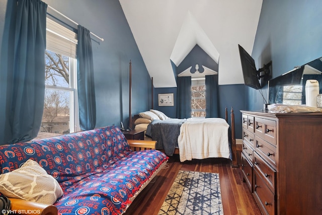 bedroom featuring vaulted ceiling and wood finished floors