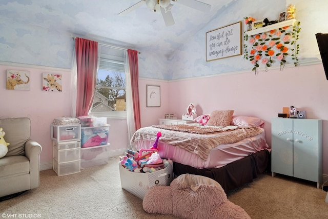 bedroom with carpet floors, vaulted ceiling, and a ceiling fan