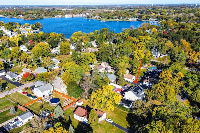 bird's eye view with a water view and a residential view