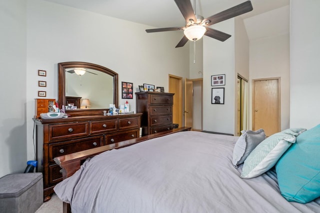 bedroom featuring ceiling fan and high vaulted ceiling