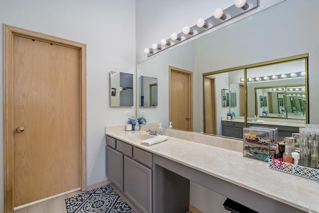 full bathroom featuring vanity and baseboards