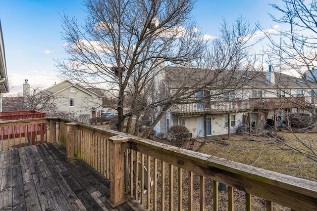 wooden terrace with a residential view