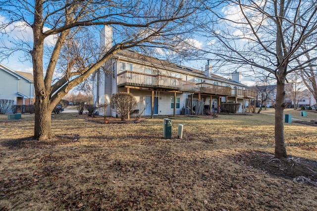 view of front of property featuring a chimney and a deck