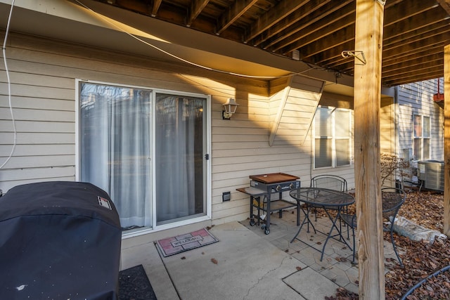 view of patio featuring outdoor dining area and a grill