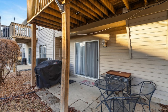 view of patio with grilling area and a balcony