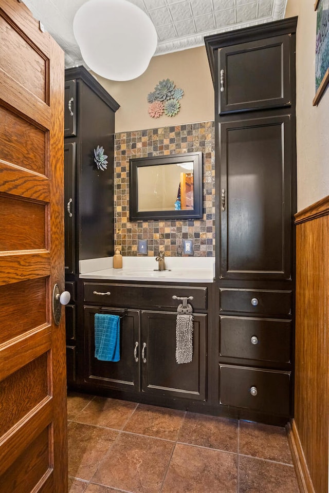 bathroom with backsplash and vanity