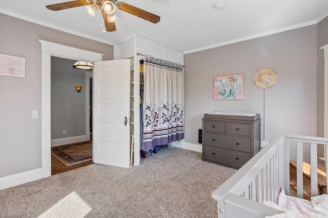 carpeted bedroom with baseboards and ornamental molding