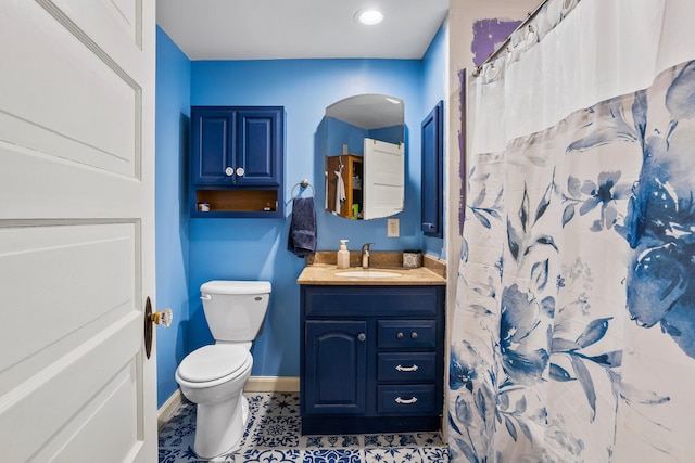 full bathroom with tile patterned flooring, toilet, a shower with shower curtain, vanity, and baseboards