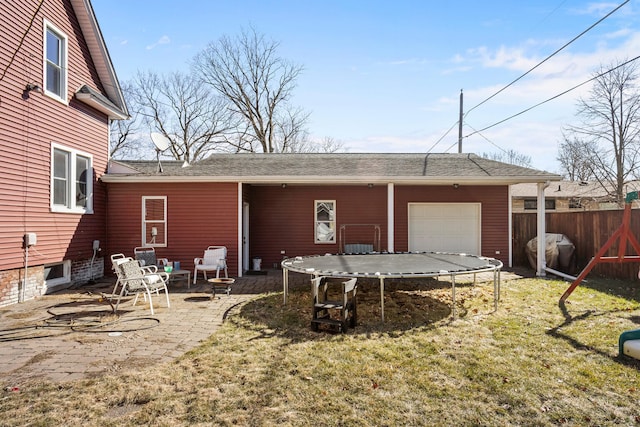 exterior space featuring a trampoline and fence