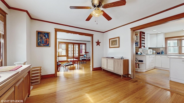 interior space featuring open shelves, light countertops, backsplash, white cabinetry, and light wood-type flooring