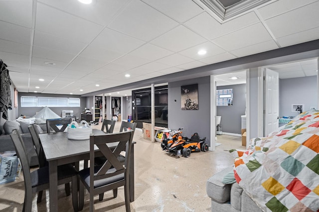 dining space with a paneled ceiling and recessed lighting