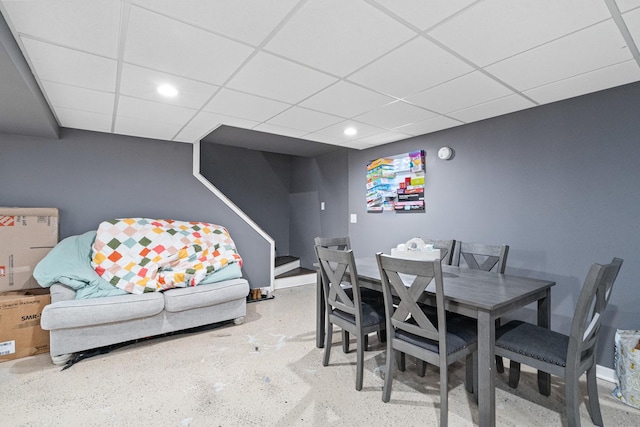 dining space featuring stairs, a drop ceiling, and recessed lighting