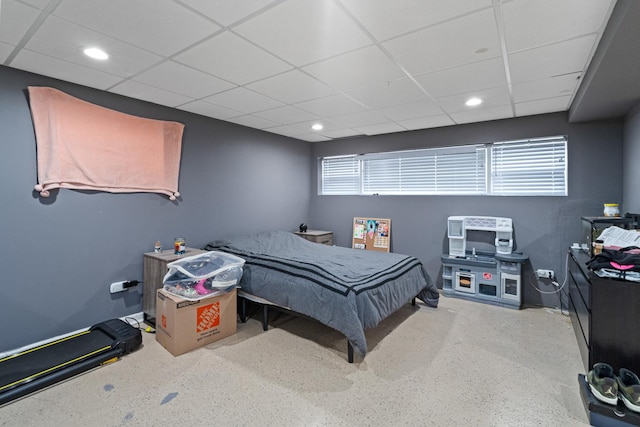 bedroom with a paneled ceiling and recessed lighting