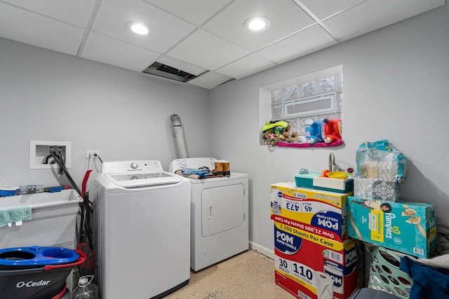laundry area with washing machine and dryer and recessed lighting