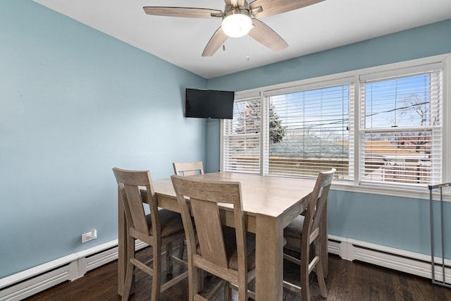dining space featuring baseboards, a ceiling fan, wood finished floors, baseboard heating, and a baseboard heating unit