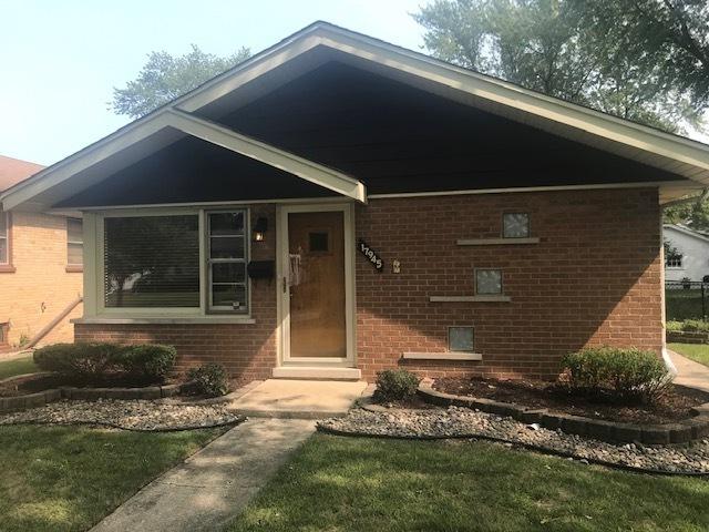 view of front of home with brick siding