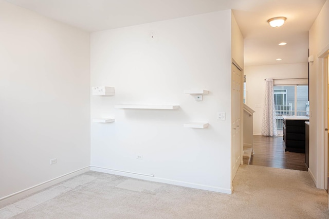 interior space featuring recessed lighting, carpet, and baseboards