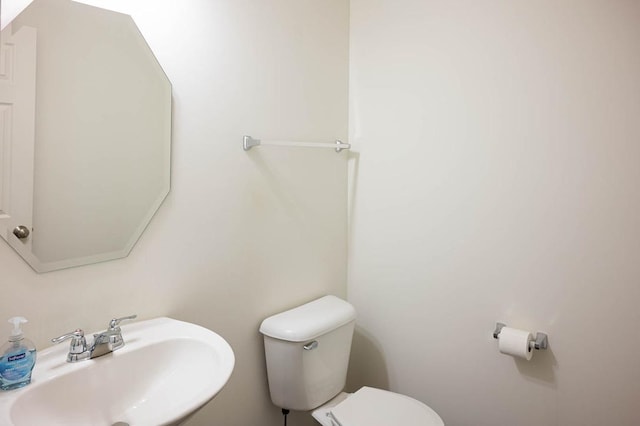 bathroom featuring a sink and toilet