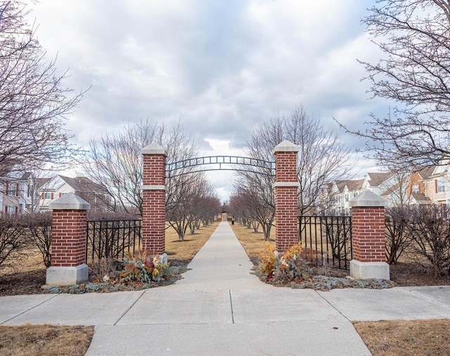 view of gate with fence