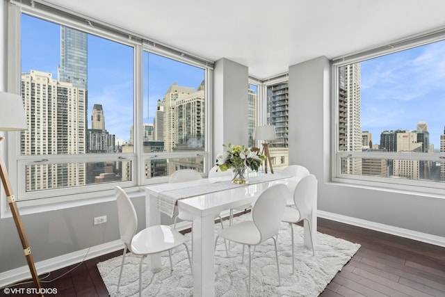 sunroom / solarium with a city view