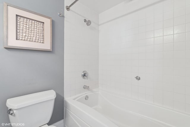 bathroom with toilet and bathing tub / shower combination