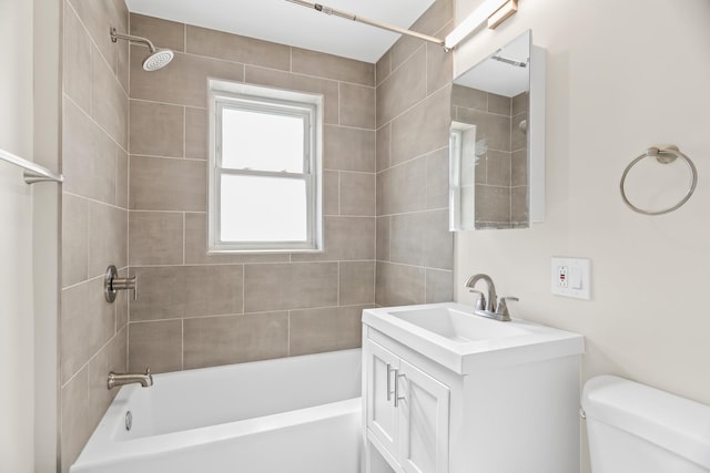 bathroom with toilet, shower / washtub combination, and vanity