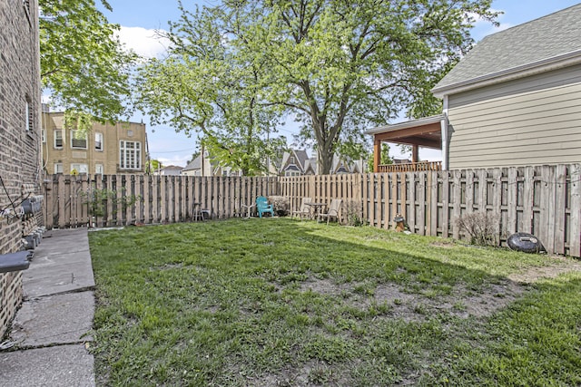 view of yard with a fenced backyard