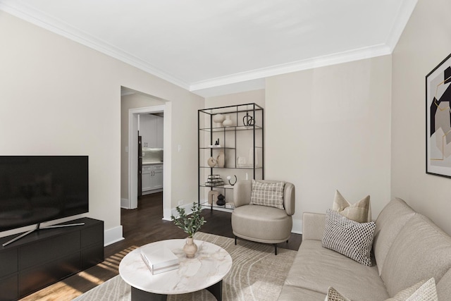 living area featuring ornamental molding, dark wood-type flooring, and baseboards