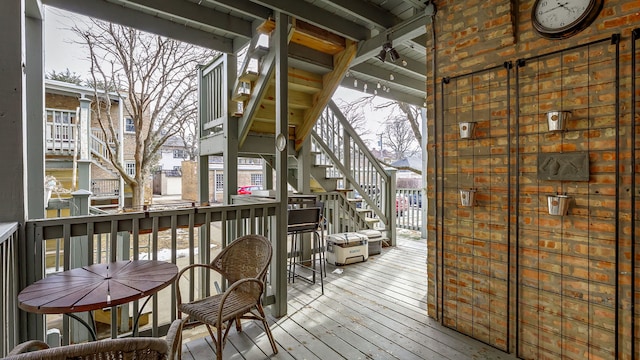 wooden deck featuring stairs