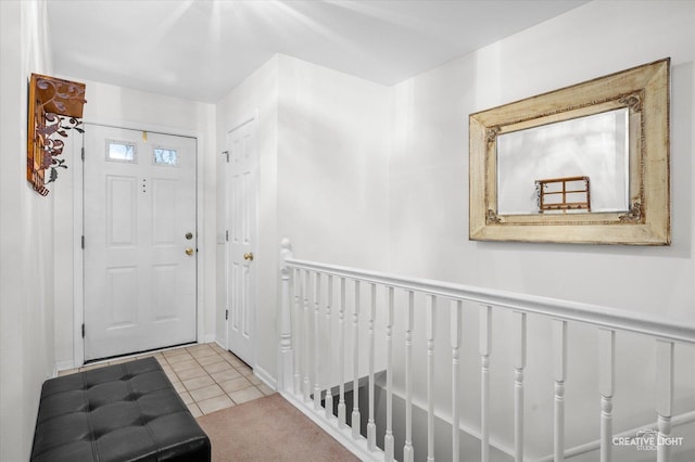 foyer with light tile patterned floors