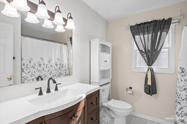 full bathroom featuring baseboards, vanity, and toilet