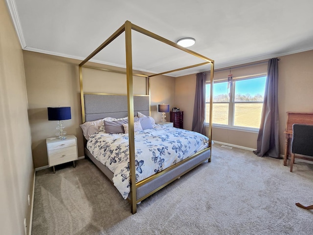 carpeted bedroom with baseboards and crown molding