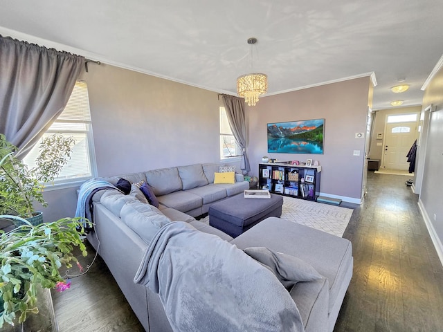 living room featuring dark wood-style floors, baseboards, a notable chandelier, and crown molding